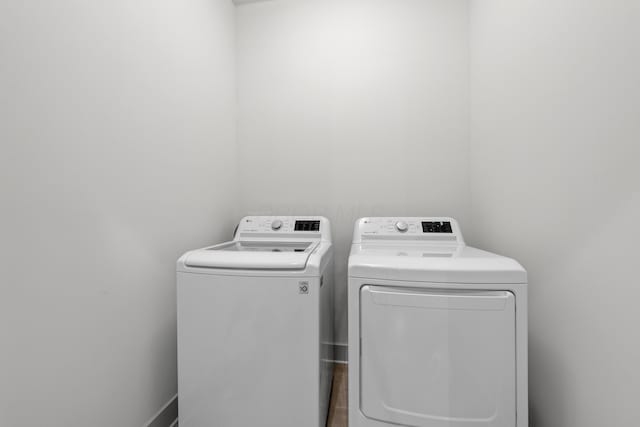 laundry area with washing machine and clothes dryer