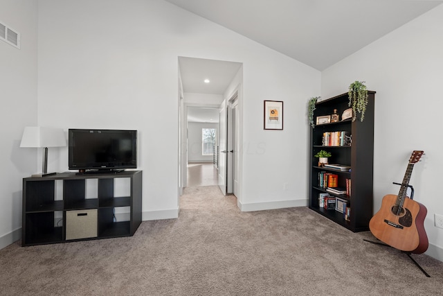 interior space featuring lofted ceiling and carpet