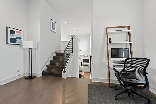 home office with dark hardwood / wood-style flooring