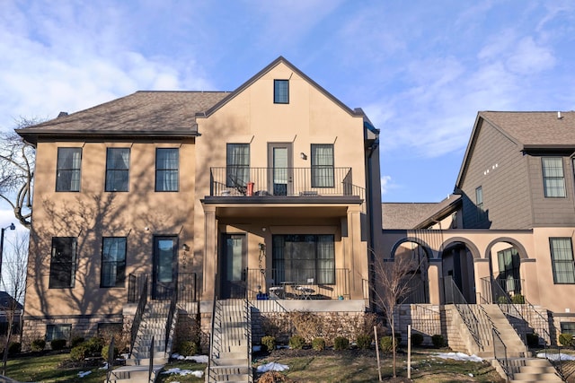 view of front of house with a balcony