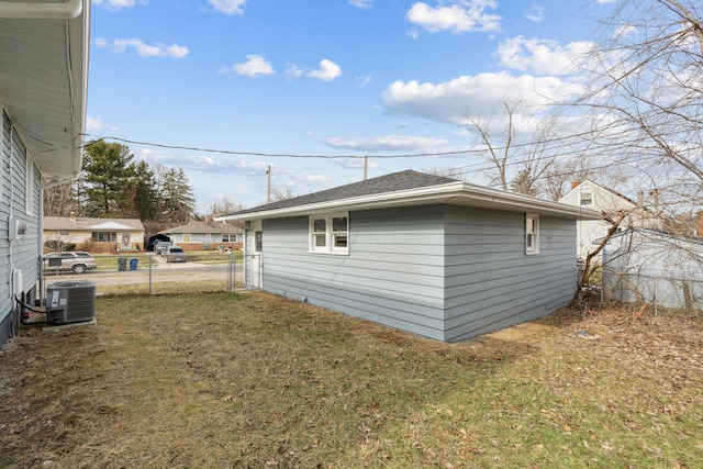 view of home's exterior with a yard and central air condition unit