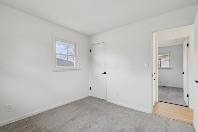 unfurnished bedroom with carpet