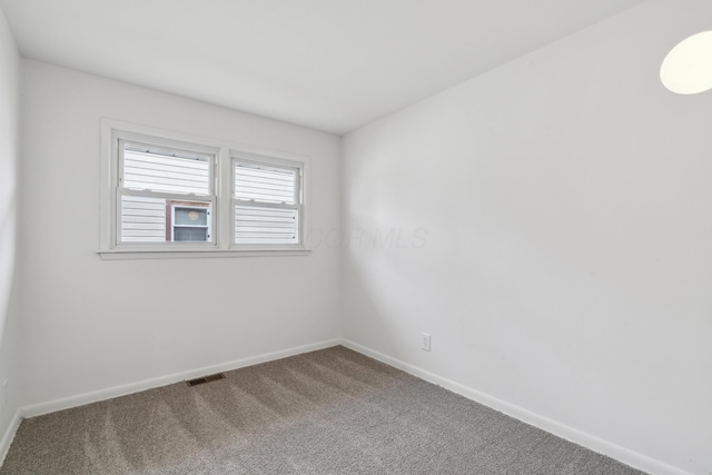 unfurnished room with carpet