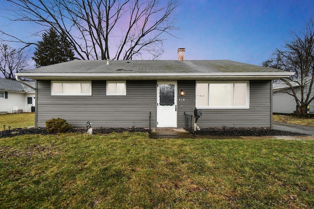 view of front of home featuring a yard