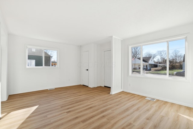 spare room with light wood-type flooring