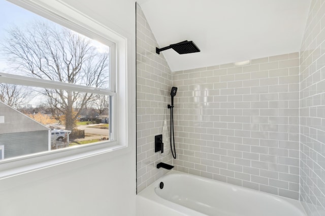 bathroom featuring vaulted ceiling