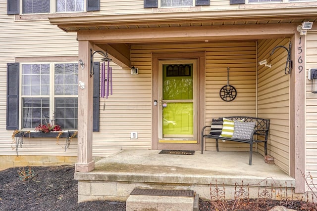 entrance to property featuring covered porch