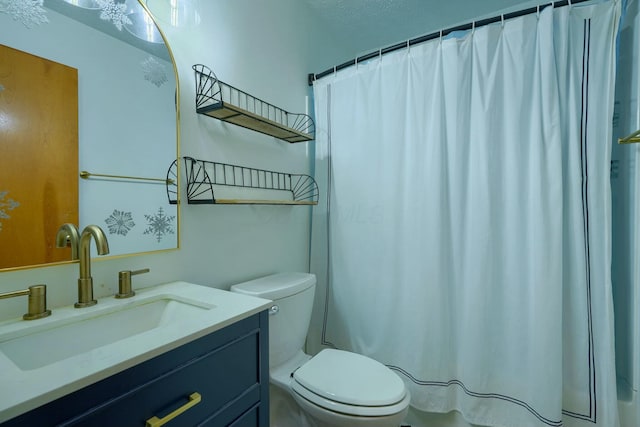 bathroom featuring vanity, toilet, and a shower with shower curtain