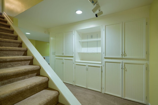 stairway with carpet floors