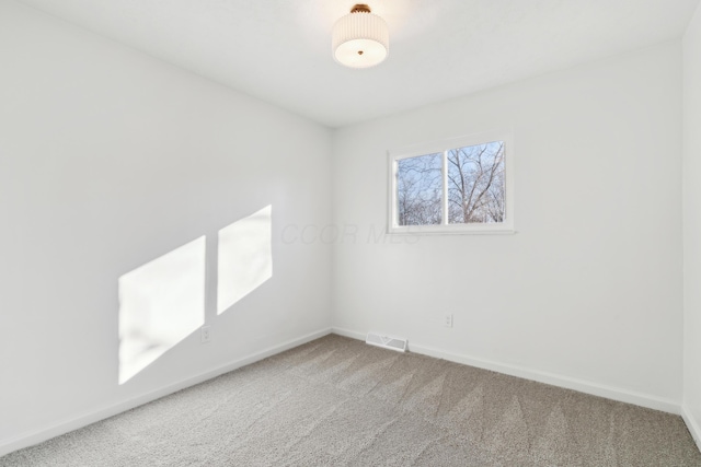 unfurnished room featuring carpet flooring