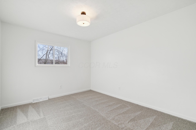 empty room featuring carpet flooring