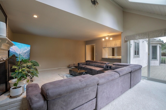 carpeted living room with lofted ceiling