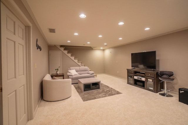 carpeted living room featuring ornamental molding