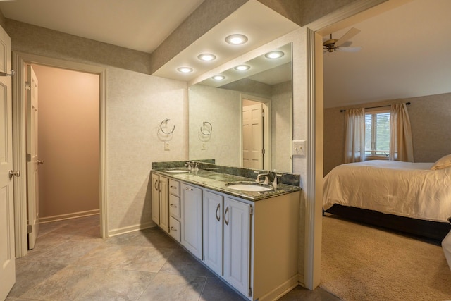 bathroom with ceiling fan and vanity