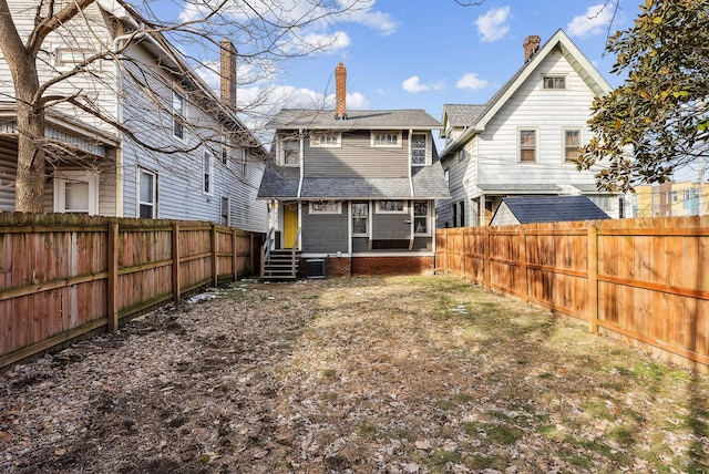 156 Winner Ave, Columbus, OH 43203 - rear view of property with entry steps, a shingled roof, a chimney, and a fenced backyard