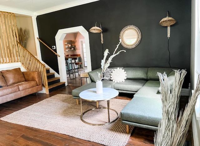 living room featuring hardwood / wood-style flooring and ornamental molding