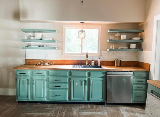 bar featuring pendant lighting, butcher block counters, sink, backsplash, and stainless steel dishwasher