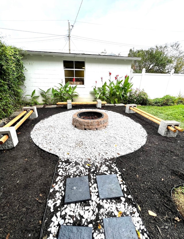 view of yard with a fire pit