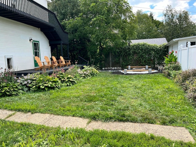 view of yard featuring a wooden deck