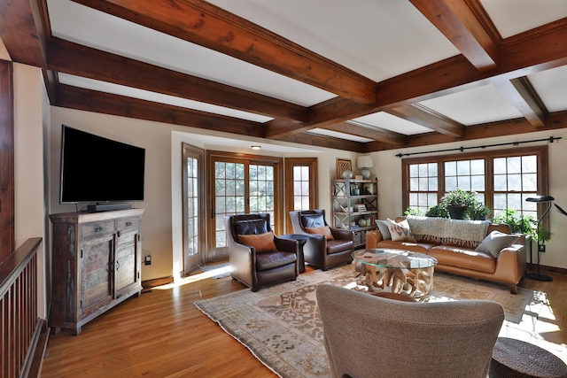 living room with beam ceiling and light wood-type flooring