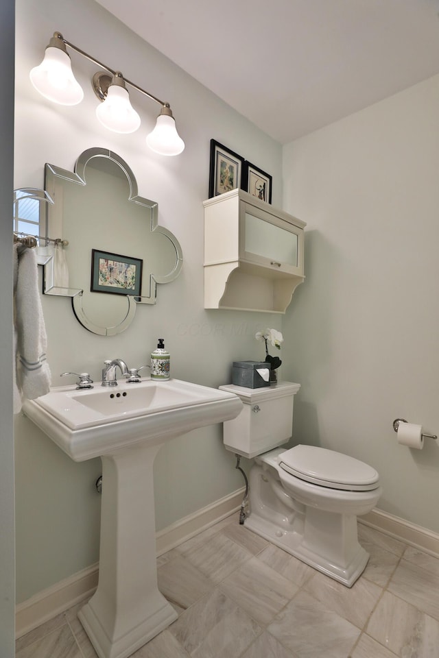 bathroom with toilet and sink