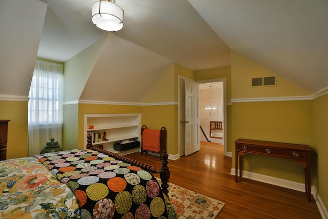 bedroom featuring vaulted ceiling and wood-type flooring