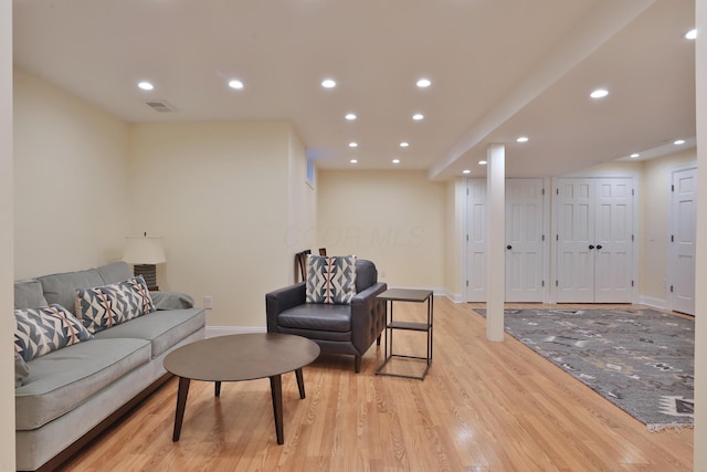 living room with light hardwood / wood-style floors