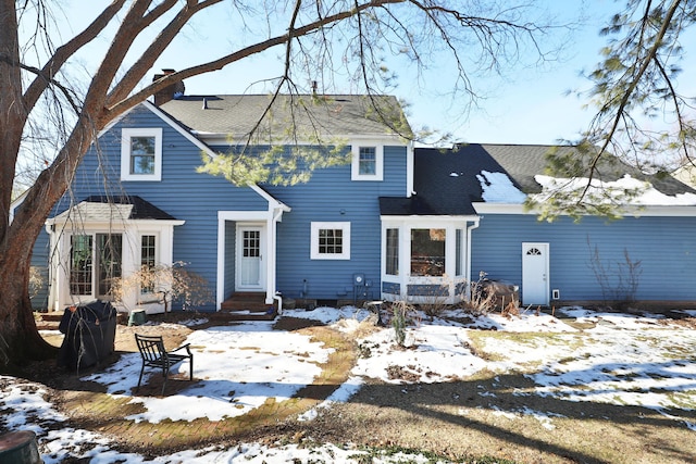 view of snow covered property