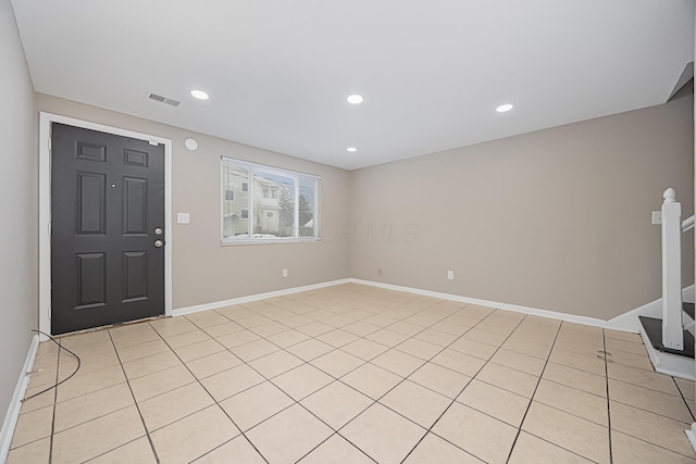 foyer entrance featuring light tile patterned floors