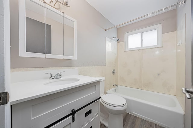 full bathroom featuring shower / bathtub combination, vanity, toilet, and hardwood / wood-style floors