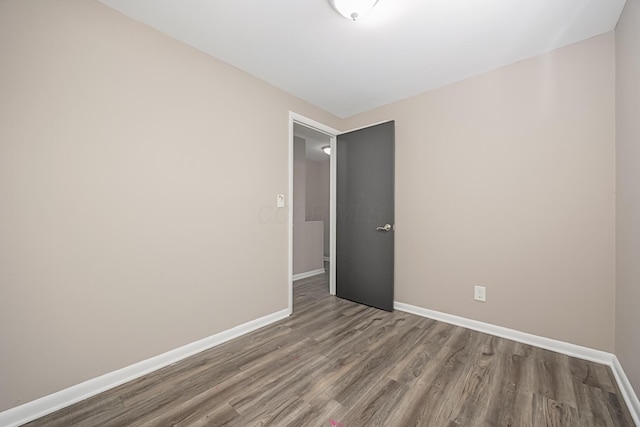 empty room with wood-type flooring