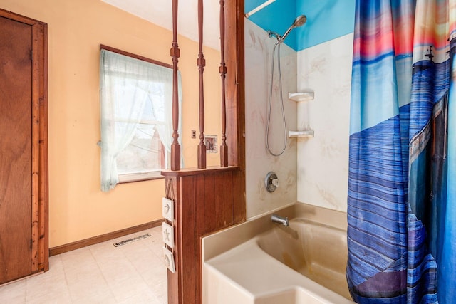 bathroom with shower / tub combo