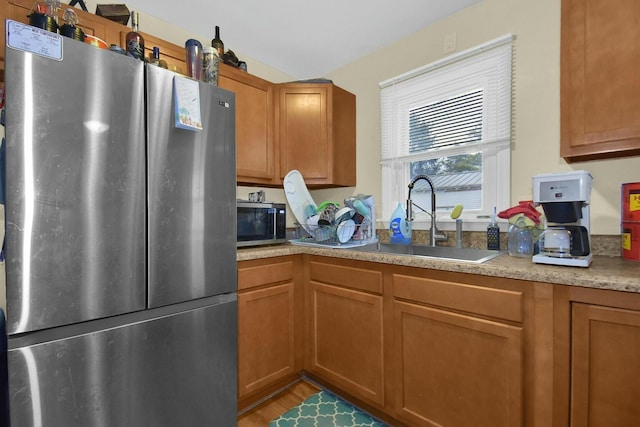 kitchen with appliances with stainless steel finishes and sink