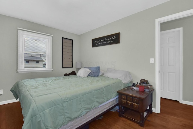 bedroom featuring dark hardwood / wood-style flooring