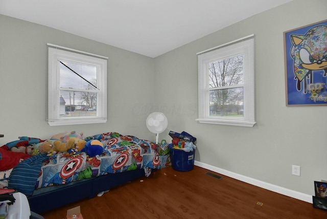 bedroom with hardwood / wood-style floors