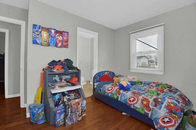 bedroom featuring dark wood-type flooring