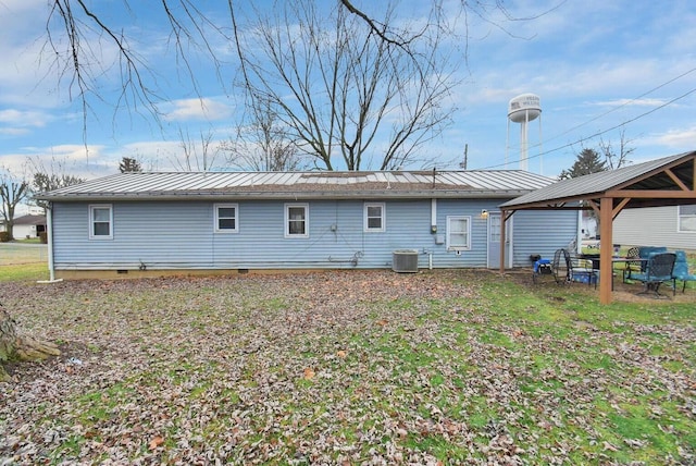 back of house featuring a gazebo and cooling unit