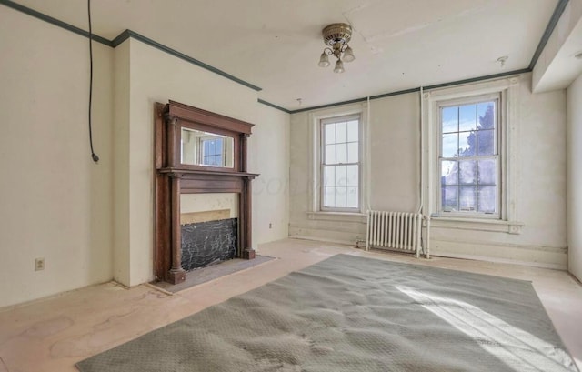 unfurnished living room featuring radiator heating unit