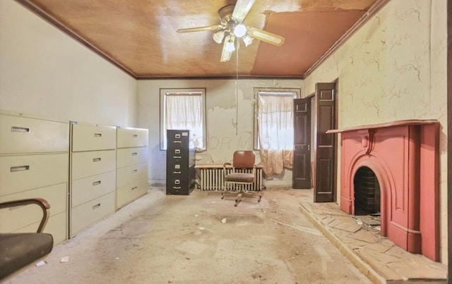 sitting room featuring crown molding and ceiling fan