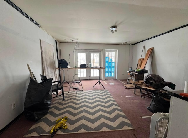 sitting room featuring carpet floors and french doors