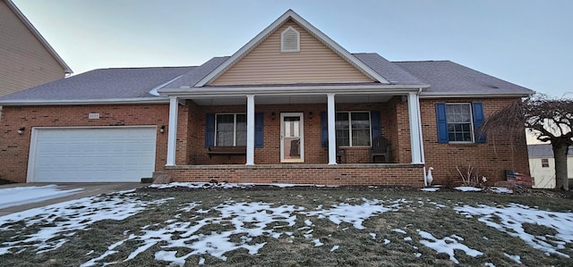 view of front of house featuring a garage and covered porch