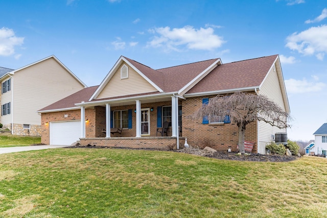 view of front of home with a front yard, central AC, a garage, and a porch