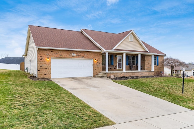 view of front of home featuring a front yard, a garage, and a porch