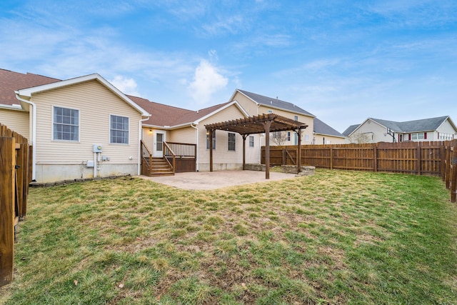 back of property with a lawn, a patio, and a pergola