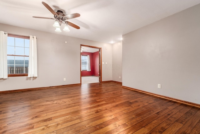 empty room with ceiling fan and light wood-type flooring