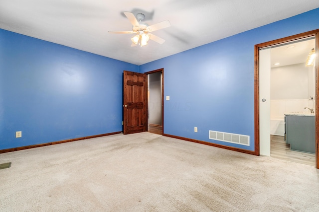 carpeted empty room with ceiling fan