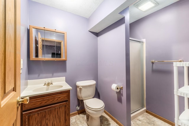 bathroom with walk in shower, vanity, and toilet