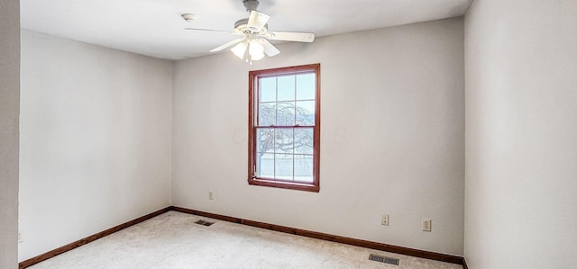 empty room with carpet and ceiling fan