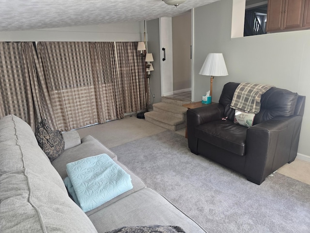 living room with light carpet and a textured ceiling