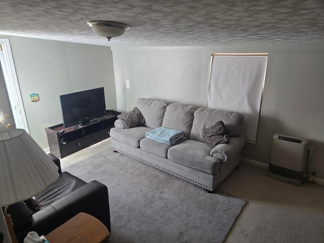 carpeted living room featuring a textured ceiling